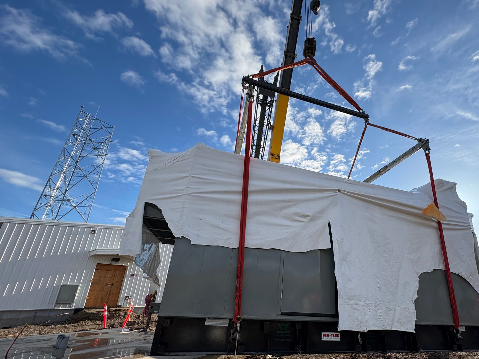 A crane lift landing equipment on a substation site